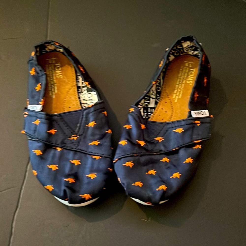 Tom’s Toddler Navy and Orange Slip On Shoes. T9